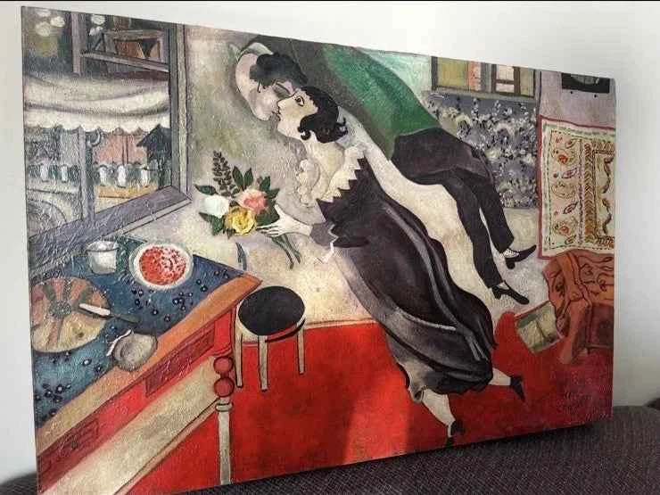 reproduction inspirée de Chagall huile sur toile-L'amour, c'est voler ensemble au-dessus du quotidien. Une œuvre qui célèbre la passion et la joie de vivre.